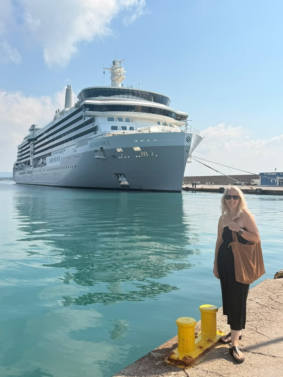 Faye on the quayside in front of the Silver Nova cruise ship